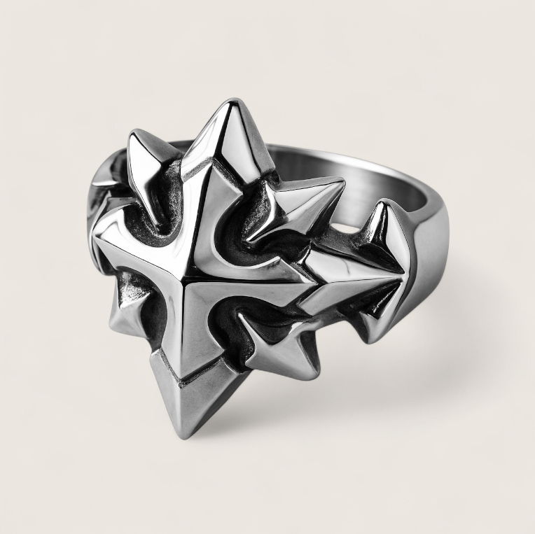 Silver spiked ring on a light gray background