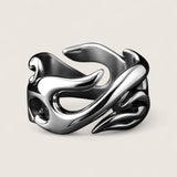 Silver ring with a unique design on a light gray background
